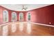 Bright bedroom featuring hardwood floors and a ceiling fan at 7825 Brands Hatch Blvd, Cumming, GA 30040