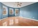 Spacious bedroom with hardwood floors and large windows at 7825 Brands Hatch Blvd, Cumming, GA 30040