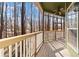 Deck with wooden railings and wooded view at 7825 Brands Hatch Blvd, Cumming, GA 30040