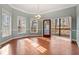 Bright dining room with hardwood floors and access to deck at 7825 Brands Hatch Blvd, Cumming, GA 30040