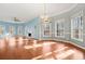 Bright dining room with hardwood floors and large windows at 7825 Brands Hatch Blvd, Cumming, GA 30040
