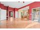 Gathering room with hardwood floors, kitchen views, and access to deck at 7825 Brands Hatch Blvd, Cumming, GA 30040