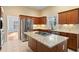 Island kitchen with granite countertops and stainless steel appliances at 7825 Brands Hatch Blvd, Cumming, GA 30040