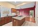 Kitchen with granite countertops, stainless steel appliances, and island at 7825 Brands Hatch Blvd, Cumming, GA 30040