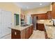 Kitchen boasts granite countertops and stainless steel appliances at 7825 Brands Hatch Blvd, Cumming, GA 30040