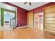 Bright library featuring hardwood floors and built-in bookshelves at 7825 Brands Hatch Blvd, Cumming, GA 30040