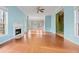 Spacious living room with hardwood floors, fireplace, and lots of natural light at 7825 Brands Hatch Blvd, Cumming, GA 30040
