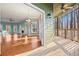 Open living room with hardwood floors and access to deck at 7825 Brands Hatch Blvd, Cumming, GA 30040