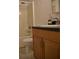Clean bathroom with shower/tub combo and wood vanity at 32 Peachtree St # 403, Atlanta, GA 30303