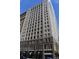 Tall city building with many windows and a classic design at 32 Peachtree St # 403, Atlanta, GA 30303