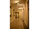 Well-lit hallway with tiled floor and elegant mirrors at 32 Peachtree St # 403, Atlanta, GA 30303