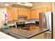 Modern kitchen featuring stainless steel appliances and wood cabinets at 32 Peachtree St # 403, Atlanta, GA 30303