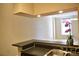 Open concept kitchen with breakfast bar and view to living room at 32 Peachtree St # 403, Atlanta, GA 30303