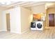 Open concept kitchen with stainless steel appliances and laundry in unit at 32 Peachtree St # 403, Atlanta, GA 30303