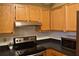 Kitchen with stainless steel appliances and wood cabinets at 32 Peachtree St # 403, Atlanta, GA 30303