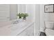 Small bathroom with white vanity, single sink, and toilet at 456 Parkway Ne Dr # 12, Atlanta, GA 30308