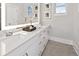 Elegant bathroom with double vanity, quartz countertop and illuminated mirror at 456 Parkway Ne Dr # 12, Atlanta, GA 30308