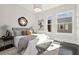 Spacious bedroom with large windows and a comfortable sitting area at 456 Parkway Ne Dr # 12, Atlanta, GA 30308