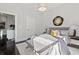 Spacious bedroom with grey bedding and a built-in bench at the foot of the bed at 456 Parkway Ne Dr # 12, Atlanta, GA 30308