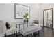 Modern dining area with glass table, bench seating, and stylish decor at 456 Parkway Ne Dr # 12, Atlanta, GA 30308