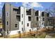 Modern building exterior with parking and green space at 456 Parkway Ne Dr # 12, Atlanta, GA 30308