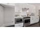 Modern kitchen with white cabinets, stainless steel appliances, and marble countertops at 456 Parkway Ne Dr # 12, Atlanta, GA 30308