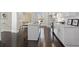 Open concept kitchen with white cabinets and hardwood floors at 456 Parkway Ne Dr # 12, Atlanta, GA 30308
