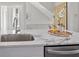 Modern kitchen island with marble countertop and stainless steel sink at 456 Parkway Ne Dr # 12, Atlanta, GA 30308