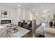 Open living room with hardwood floors and a modern fireplace at 456 Parkway Ne Dr # 12, Atlanta, GA 30308