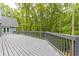Large deck with access from house and view of woods at 9635 Haverhill Ln, Johns Creek, GA 30022