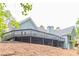 Spacious deck overlooks wooded backyard at 9635 Haverhill Ln, Johns Creek, GA 30022