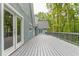 Spacious deck with gray wood and white french doors at 9635 Haverhill Ln, Johns Creek, GA 30022