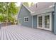 Gray deck with access to house and view of woods at 9635 Haverhill Ln, Johns Creek, GA 30022