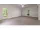 Unfinished basement with large windows and high ceilings at 9635 Haverhill Ln, Johns Creek, GA 30022