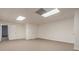Spacious basement office with neutral walls and carpeting at 9635 Haverhill Ln, Johns Creek, GA 30022