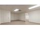 Unfinished basement room with a door and neutral walls at 9635 Haverhill Ln, Johns Creek, GA 30022