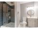 Modern bathroom with gray tile shower and updated vanity at 9635 Haverhill Ln, Johns Creek, GA 30022