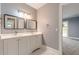 Modern bathroom with double vanity and neutral colors at 9635 Haverhill Ln, Johns Creek, GA 30022