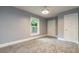 Spacious bedroom with gray walls and neutral carpeting at 9635 Haverhill Ln, Johns Creek, GA 30022