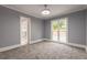 Spacious bedroom with gray walls, carpet, and large window at 9635 Haverhill Ln, Johns Creek, GA 30022