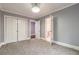 Spacious bedroom with double doors and en-suite bathroom at 9635 Haverhill Ln, Johns Creek, GA 30022