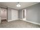 Comfortable bedroom with gray walls, carpet, and an ensuite bathroom at 9635 Haverhill Ln, Johns Creek, GA 30022