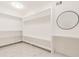 Bright walk-in closet with ample shelving and hanging space at 9635 Haverhill Ln, Johns Creek, GA 30022
