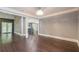 Spacious dining room with dark hardwood floors and neutral walls at 9635 Haverhill Ln, Johns Creek, GA 30022