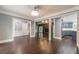 Open concept dining room with hardwood floors and kitchen views at 9635 Haverhill Ln, Johns Creek, GA 30022