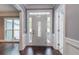 Bright entryway with hardwood floors and a stylish front door at 9635 Haverhill Ln, Johns Creek, GA 30022