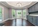 Bright kitchen nook with built-in cabinetry and hardwood floors at 9635 Haverhill Ln, Johns Creek, GA 30022