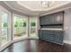 Kitchen nook with built-in cabinetry and hardwood floors at 9635 Haverhill Ln, Johns Creek, GA 30022