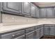 Gray kitchen cabinets and white quartz countertops at 9635 Haverhill Ln, Johns Creek, GA 30022