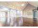 Spacious living area with hardwood floors and built-in shelving at 9635 Haverhill Ln, Johns Creek, GA 30022